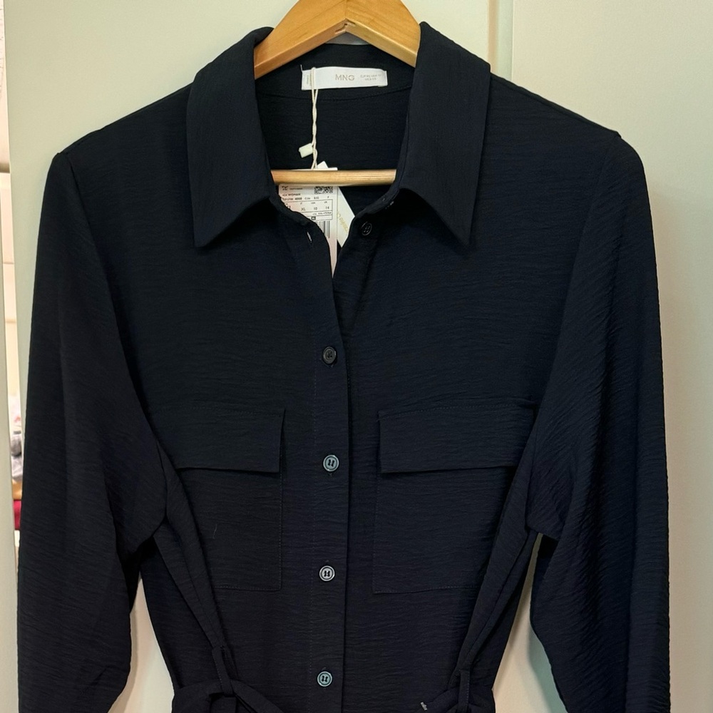 Beautiful button down dress with detachable belt.